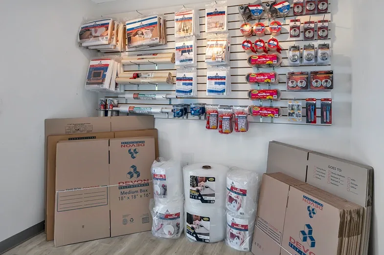 Moving and packing supplies including boxes, tape, and locks available for purchase